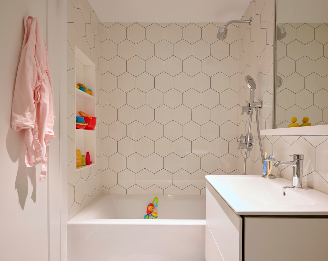 Upper West Side, Duplex, Bathroom with hexagon white tile by Sherman Architects